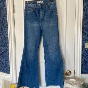 Vintage-style Flared Jeans with Frayed Hem